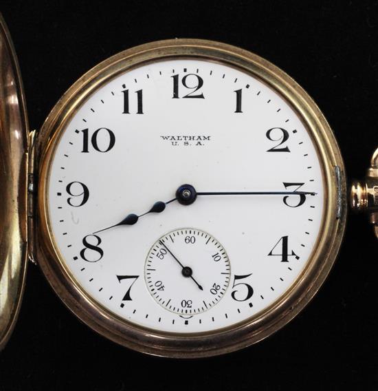 A George V 9ct gold Waltham half hunter pocket watch, on 15ct gold albert with 9ct gold gem set fob,